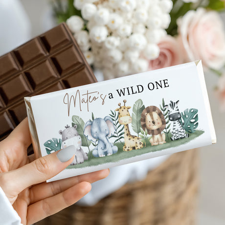 Chocolate bar wrapper with watercolor jungle animals and text "Mateo's a WILD ONE"