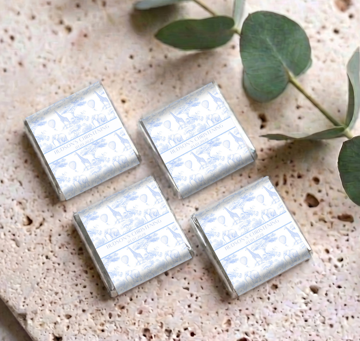 Set of personalised mini chocolates with blue christening wording in silver foil wrappers