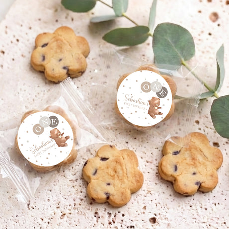 Personalised chocolate chip cookies with two round bear labels and several biscuits