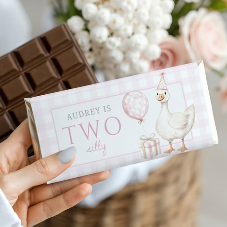 Wrapped chocolate bar with plaid label, goose and balloon illustration