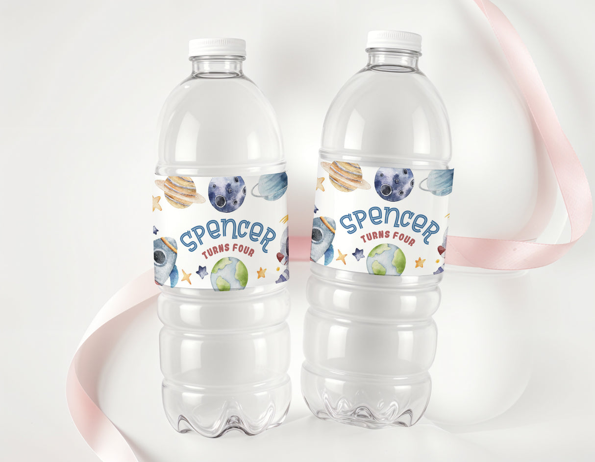 Space astronaut drink bottle labels on clear water bottles with Spencer text