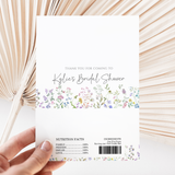 White printed chocolate wrapper with floral border, thank-you text and barcode