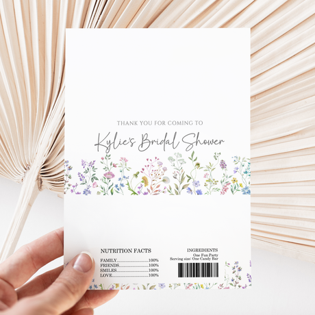 White printed chocolate wrapper with floral border, thank-you text and barcode