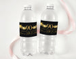 Personalised 90th birthday water bottle labels on clear plastic bottles with black and gold text