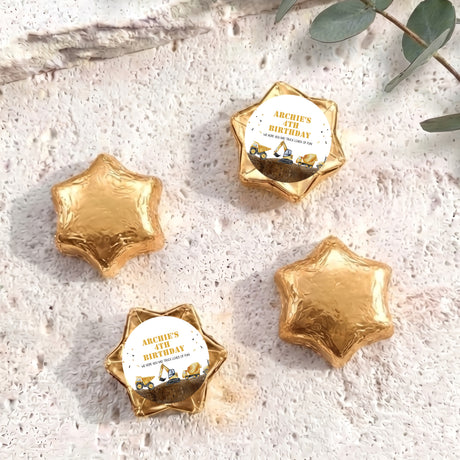 Foil-covered chocolate star sweets in gold, with birthday foil label