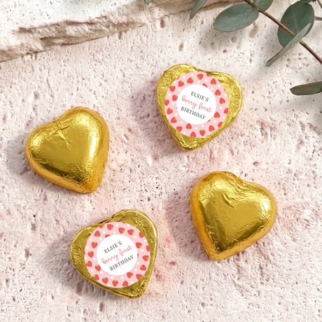 Gold foil-covered chocolate hearts with 'Elsie's berry first birthday' label.