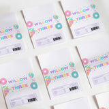 Birthday chocolate wrappers with colorful “Willow Three” donut graphic and multicolor accents