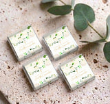 Set of four cream mini chocolate boxes with green leaf floral accents