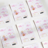 Pink baptism chocolate wrappers with teddy bear, balloons, and cross design