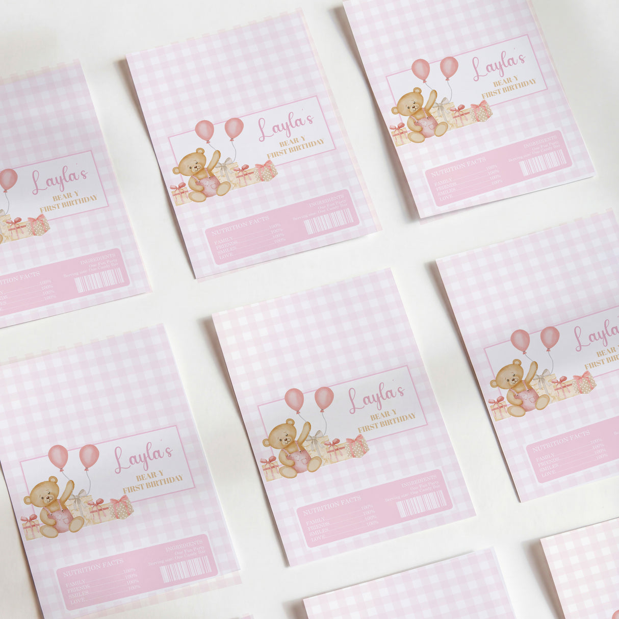 Pink gingham chocolate wrappers with teddy bear and balloons