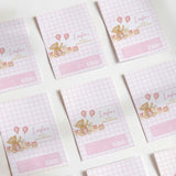 Pink gingham chocolate wrappers with teddy bear and balloons