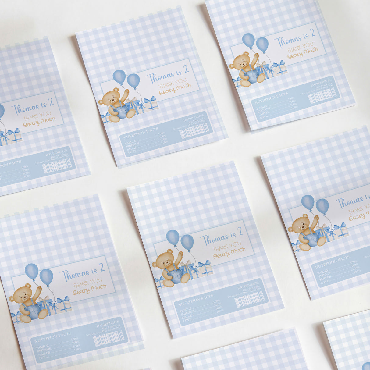 Blue gingham chocolate wrappers with teddy bear and balloons, birthday thank-you text