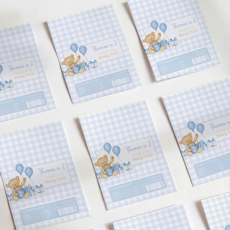 Blue gingham chocolate wrappers with teddy bear and balloons, birthday thank-you text
