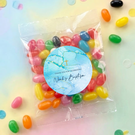 Personalised jelly bean bag with blue label, gold cross, filled with colorful jelly beans