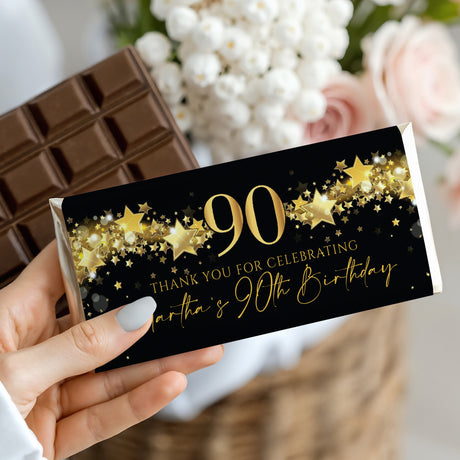 Chocolate bar wrapper, black with gold stars and 90th birthday text