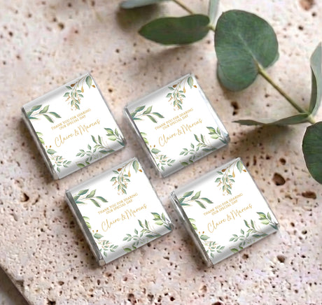 Set of four eucalyptus gold personalised mini chocolate wrappers with gold “Claire & Marcus”