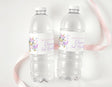 Personalised unicorn birthday water bottle labels on two clear plastic bottles