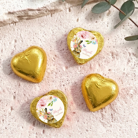 Gold foil-covered chocolate hearts with floral wrapped center medallions