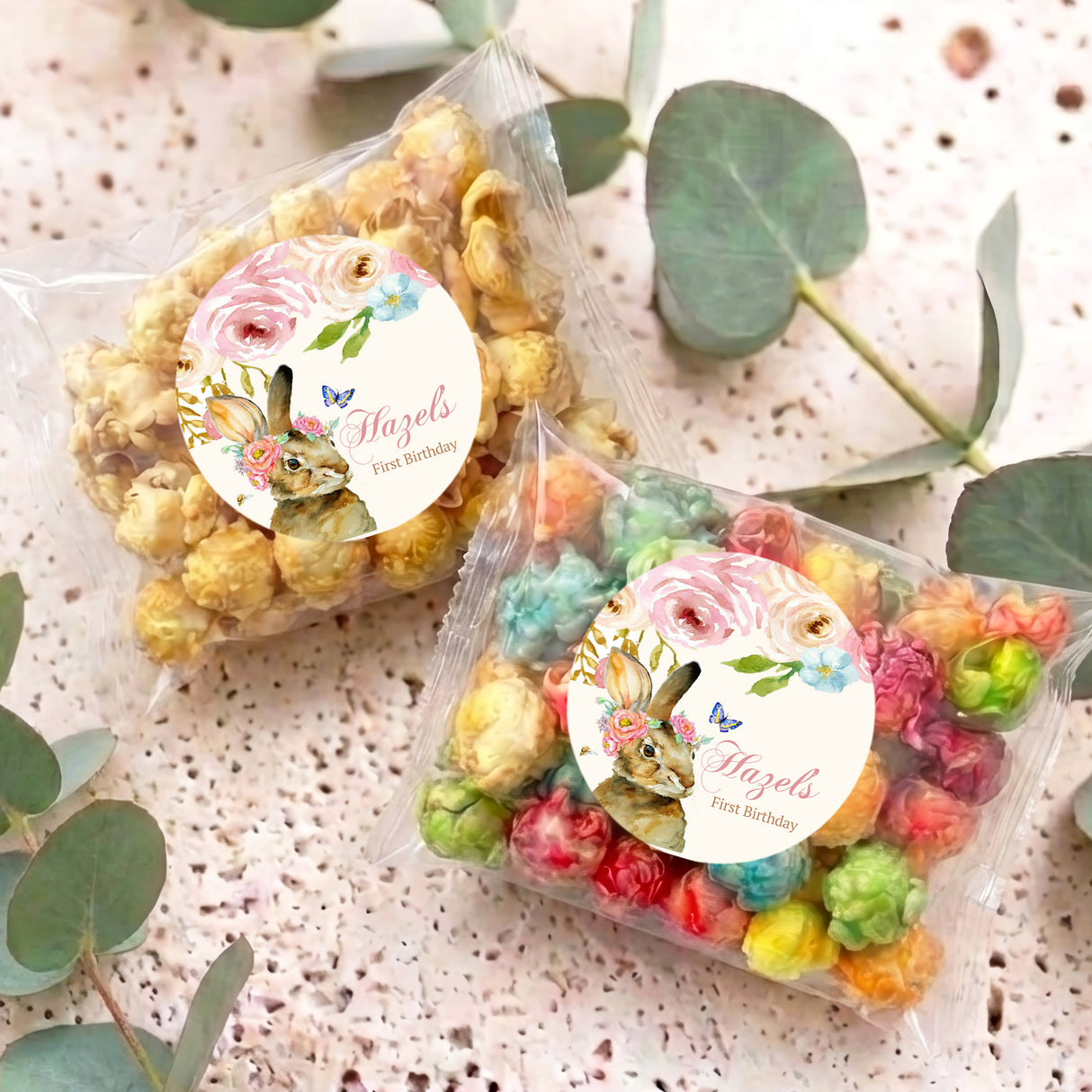 Personalised popcorn bag with round floral bunny label and multicolor pastel popcorn
