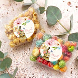 Personalised popcorn bag with round floral bunny label and multicolor pastel popcorn