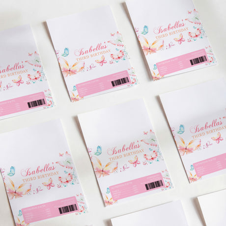 Printed chocolate wrappers with watercolor butterflies and pink birthday text, DIY set