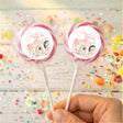 Personalised lollipops with clear wrappers and round Sophia turns two labels