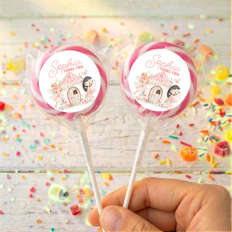 Personalised lollipops with clear wrappers and round Sophia turns two labels
