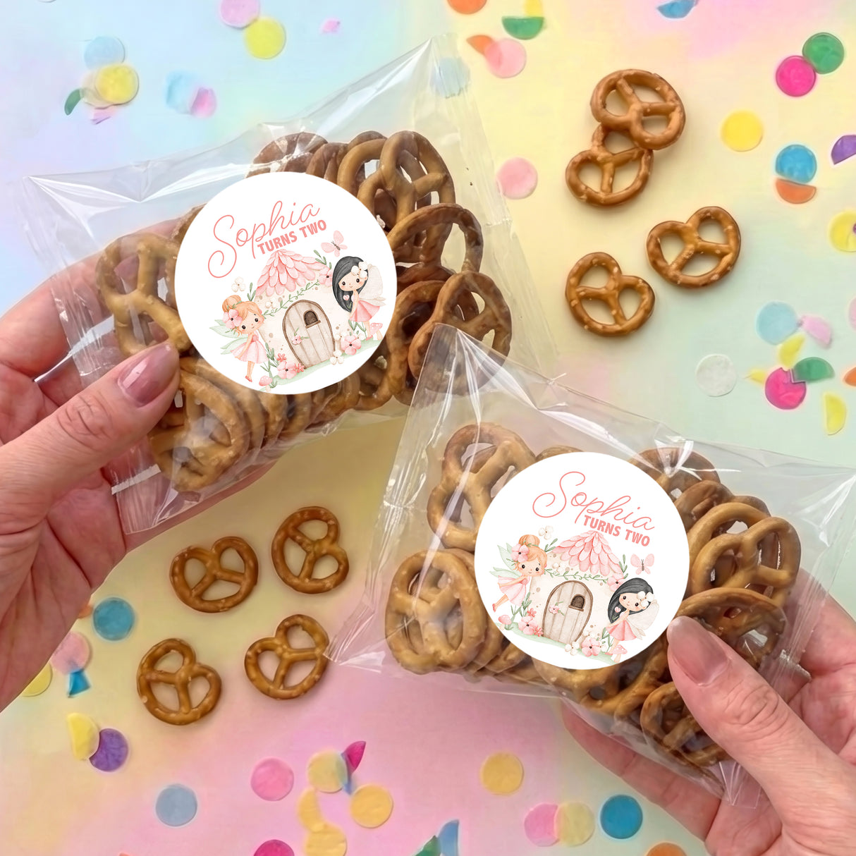 Personalised pretzel snack bags with clear wrap and round white label reading Sophia