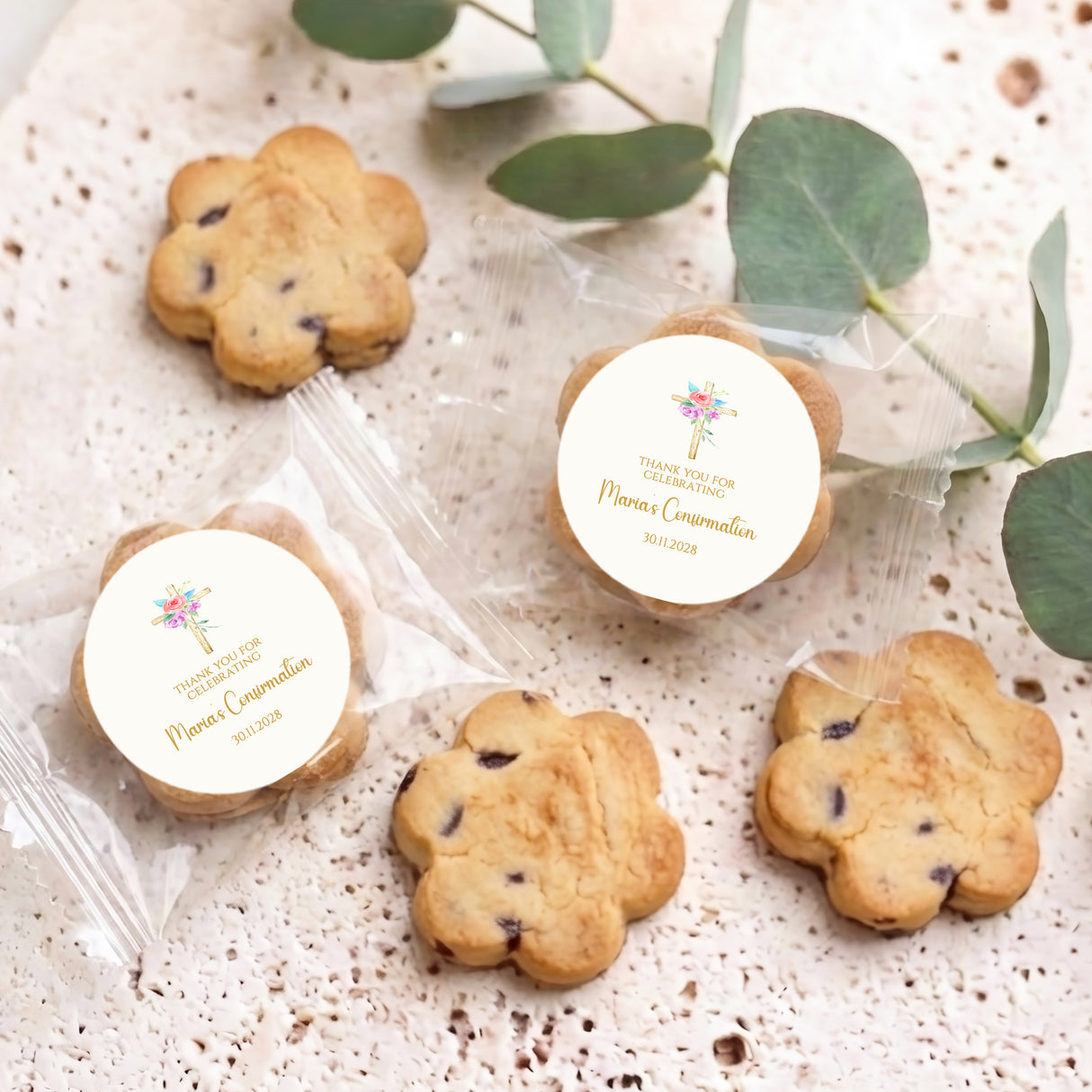 Assorted bite-size chocolate chip cookies with floral holy-cross personalised round labels