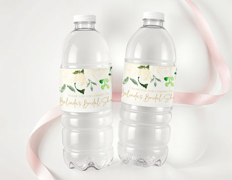 Personalised bridal shower water bottle labels on clear plastic bottles with floral greenery