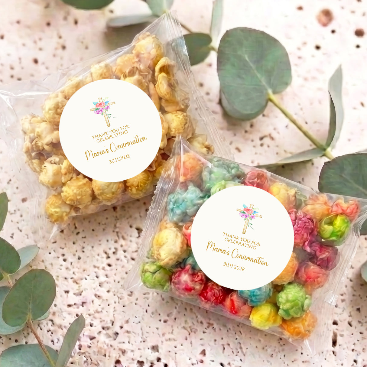 Personalised popcorn bag set with round floral holy cross stickers and colorful popcorn inside.