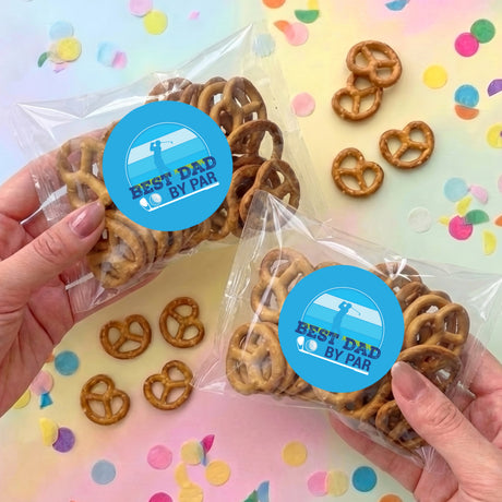 Personalised pretzel bag with brown pretzels and blue “Best Dad By Par” label, clear wrap