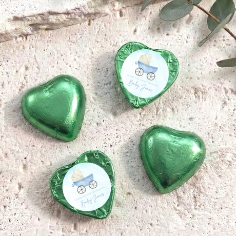 Green foil heart chocolates with baby carriage design, set of four