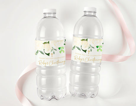 Christening water bottle labels on two clear bottles, white floral design with green cross