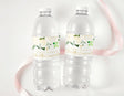 Clear plastic water bottles with white floral personalised confirmation labels
