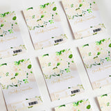 Confirmation chocolate wrappers, floral green and cream with script text and barcode labels