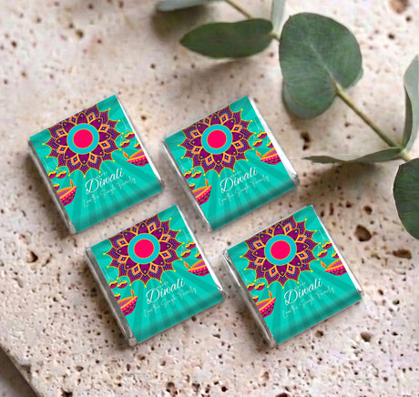 Four personalized mini chocolate packs, teal Diwali mandala graphics with pink circular center