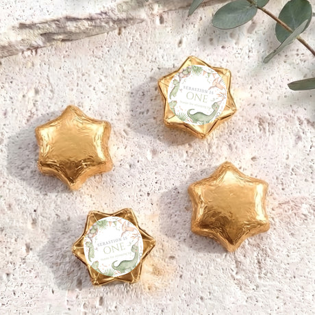 Gold foil star chocolates with personalised 'One' label, dinosaur theme