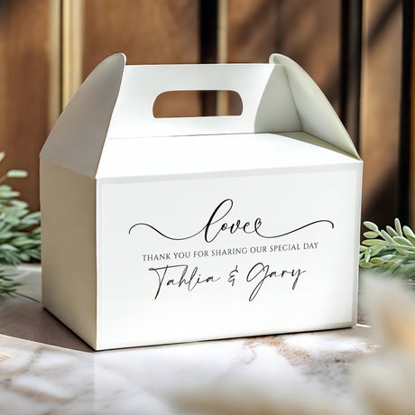 White gable wedding favour box with handle cutout and 'Love' script with names