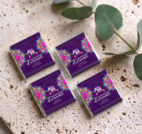 Four purple mini chocolate favors with elephant and Happy Diwali text