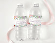 Personalised christening water bottle labels on two clear bottles, floral wreath design
