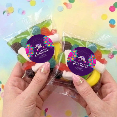 Two transparent lolly party mix bags with colorful sweets and purple elephant Diwali seals