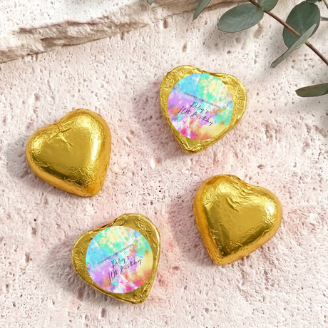 Gold foil covered heart chocolates with colorful printed center