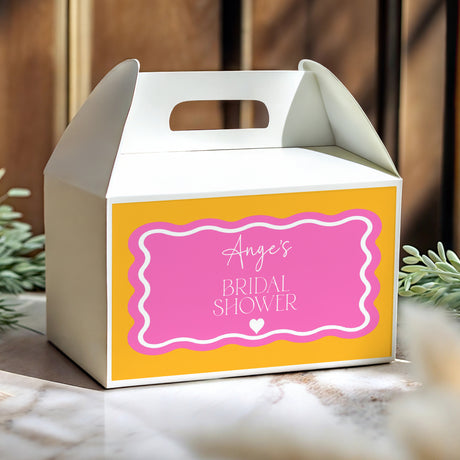 Yellow gable favor box with pink bridal shower label and handle cutout