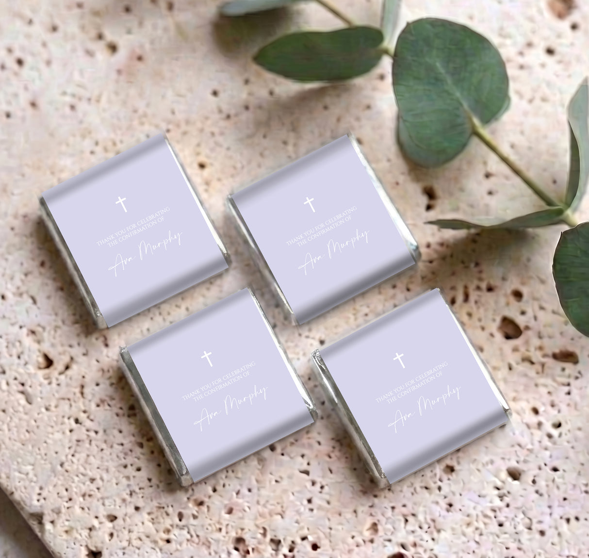 Set of personalised mini chocolates in lilac wrappers with cross and white message