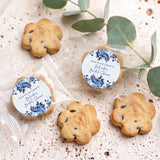 Bite-size choc chip cookies with two round blue floral thank-you labels, packaged