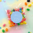 Personalised jelly bean party bags with clear wrappers and light-blue Love stickers