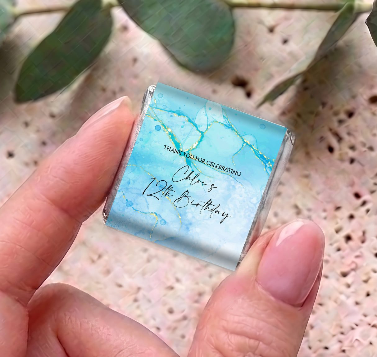 Personalised mini chocolates in blue square foil with gold marble pattern and birthday text