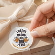 Round printed birthday label: Cheers & Beers to 100 years, with beer mug icons