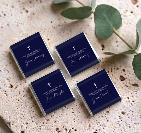 Set of four navy mini chocolate boxes with white cross and personalized script text